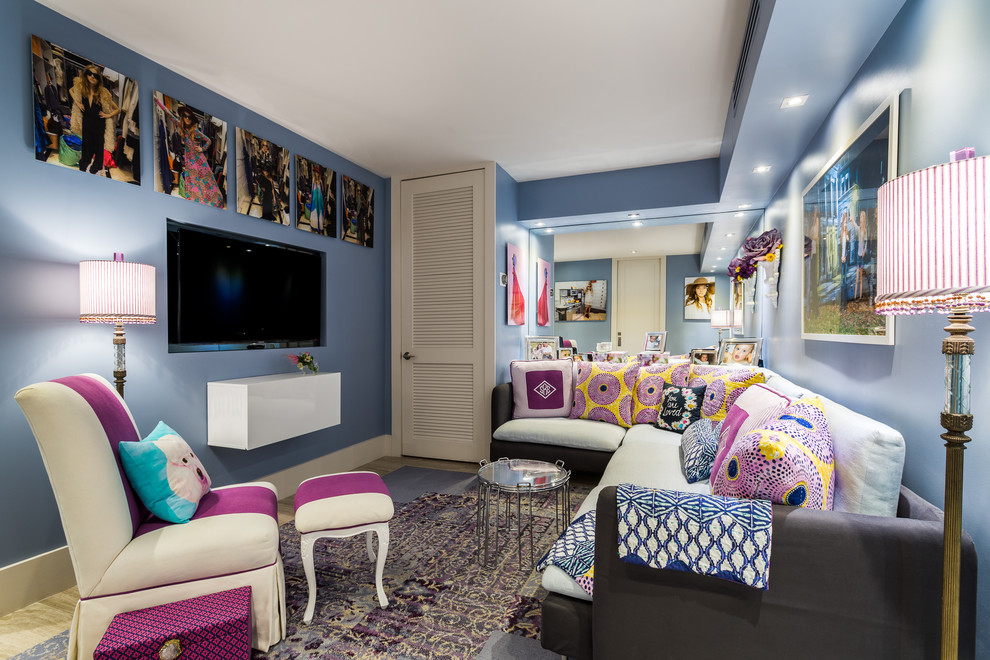 This is an example of a large eclectic kids' room for girls in Miami with blue walls, carpet and multi-coloured floor.