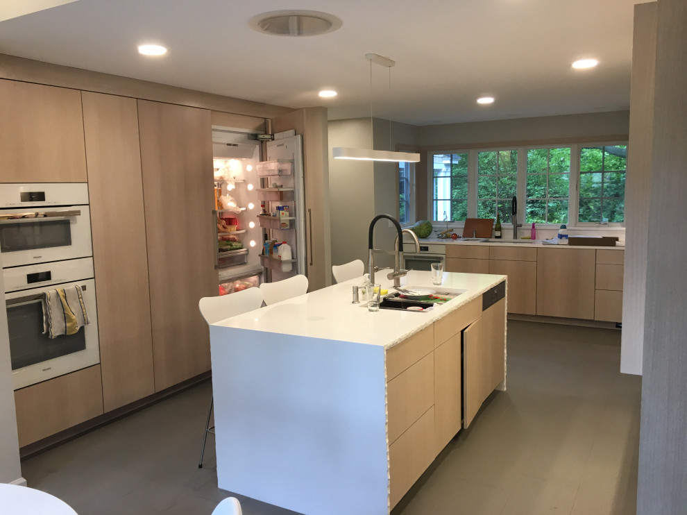 Inspiration for a large contemporary u-shaped eat-in kitchen in New York with a double-bowl sink, light wood cabinets, quartz benchtops, white splashback, white appliances, ceramic floors, with island, grey floor and white benchtop.