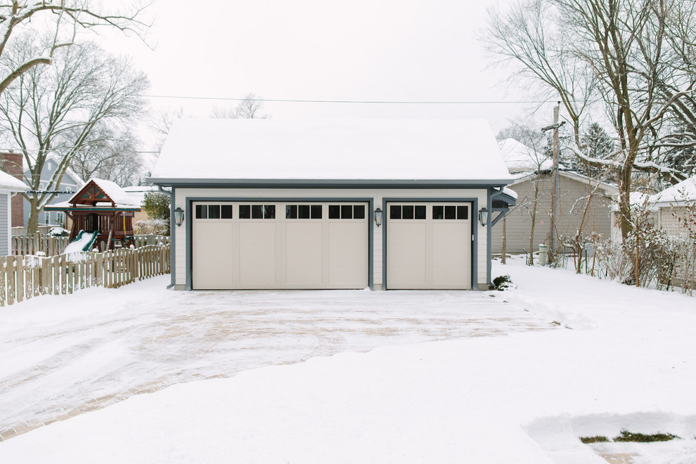 Photo of a mid-sized eclectic detached three-car carport in Chicago.