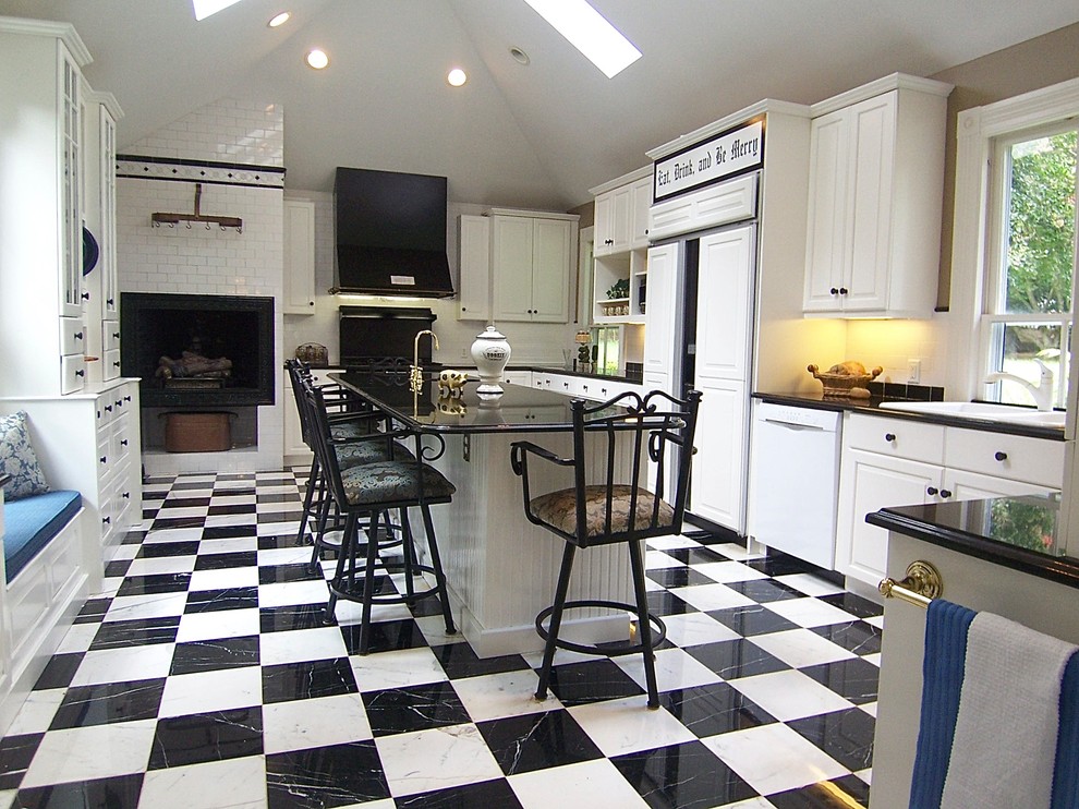 Large traditional kitchen in Raleigh with a drop-in sink, raised-panel cabinets, white cabinets, white appliances, marble floors, with island and multi-coloured floor.
