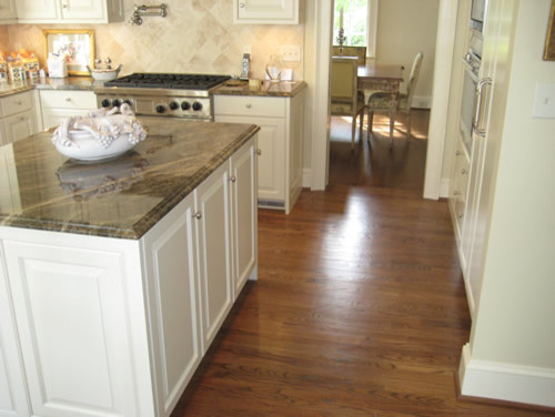 Photo of a traditional kitchen in Charleston with dark hardwood floors.