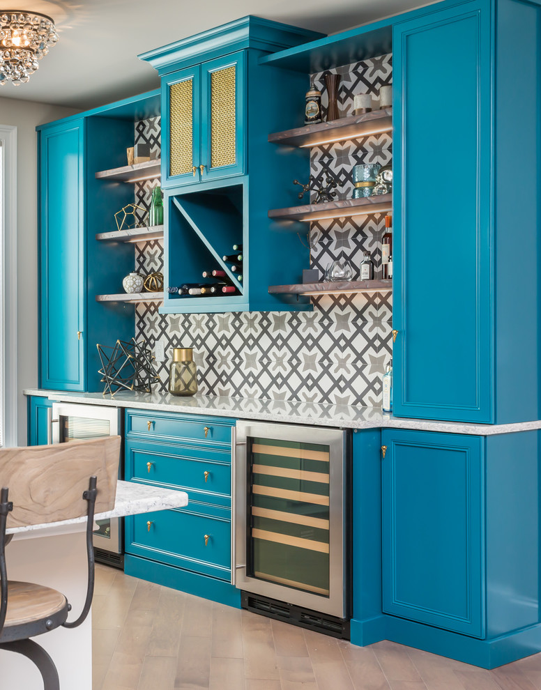 This is an example of a mid-sized contemporary single-wall home bar in Raleigh with flat-panel cabinets, blue cabinets, quartz benchtops, multi-coloured splashback, cement tile splashback and dark hardwood floors.