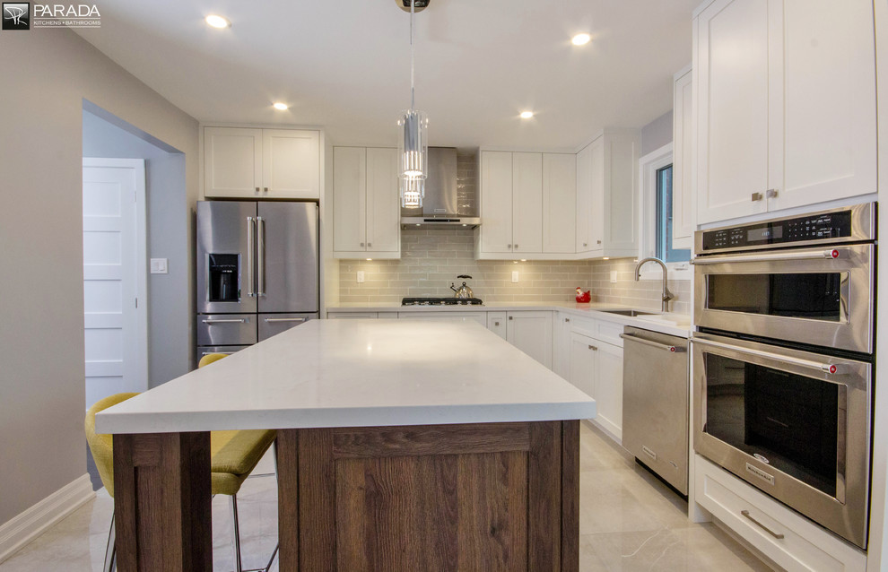 Example of a transitional kitchen design in Toronto