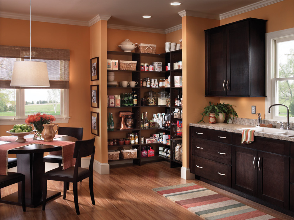 Photo of a traditional eat-in kitchen in Other with open cabinets and dark wood cabinets.