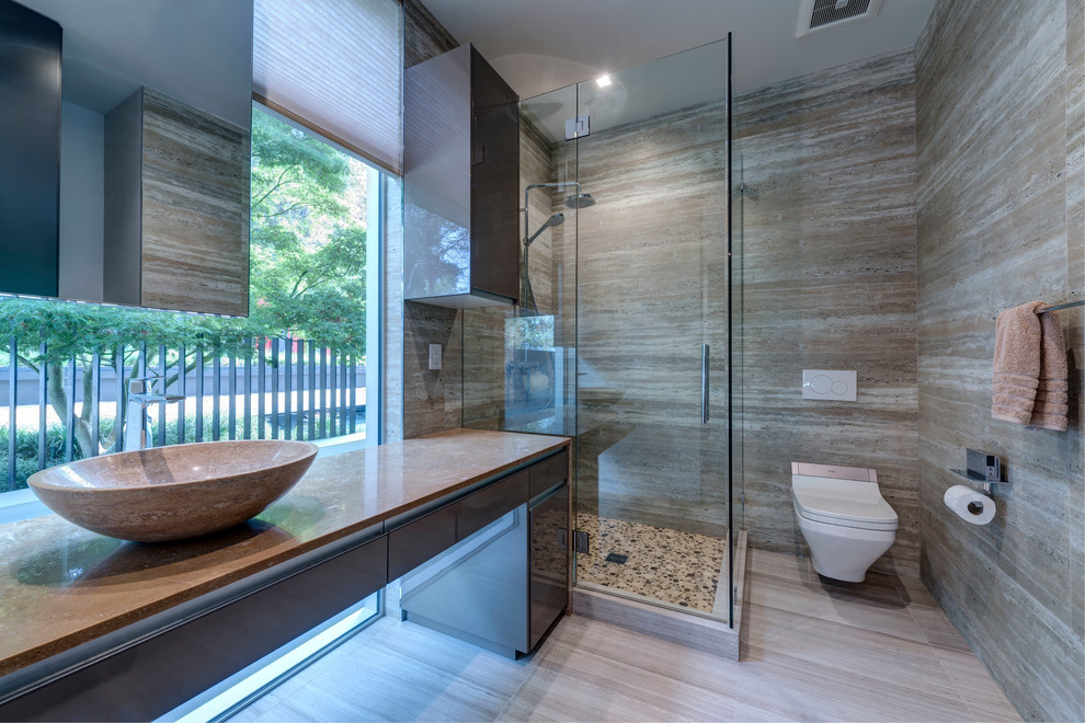 Design ideas for a contemporary 3/4 bathroom in San Francisco with an open shower, a wall-mount toilet, beige tile, ceramic tile, beige walls, ceramic floors, a pedestal sink, marble benchtops, beige floor, a hinged shower door and beige benchtops.
