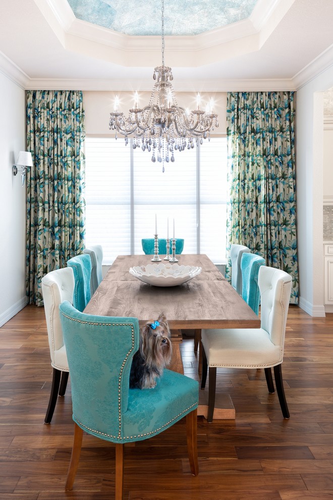 Mid-sized elegant medium tone wood floor and brown floor kitchen/dining room combo photo in Miami with white walls and no fireplace