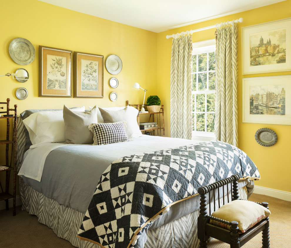 Inspiration for a traditional bedroom in New York with yellow walls, carpet, no fireplace and beige floor.