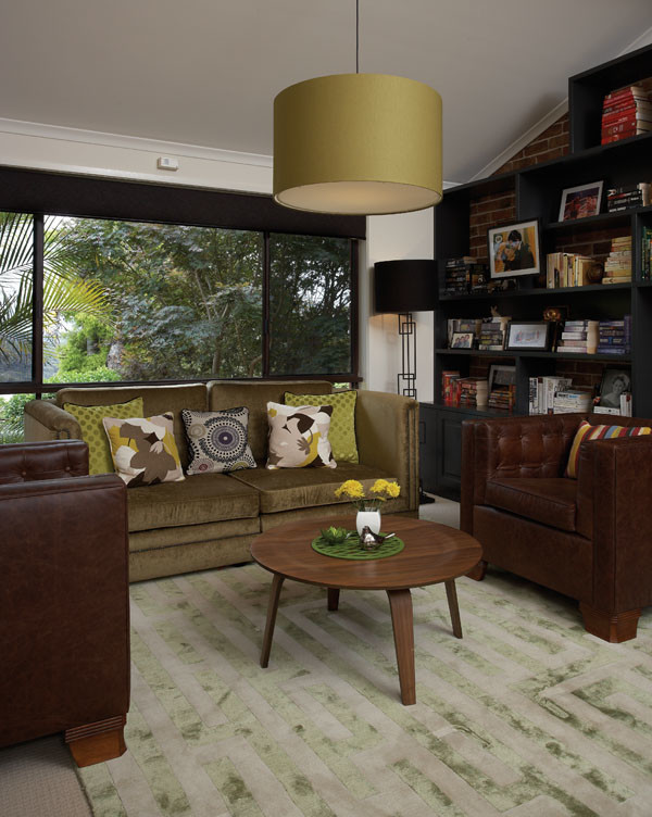 Mid-sized midcentury open concept living room in Sydney with a library, white walls, carpet and a wall-mounted tv.