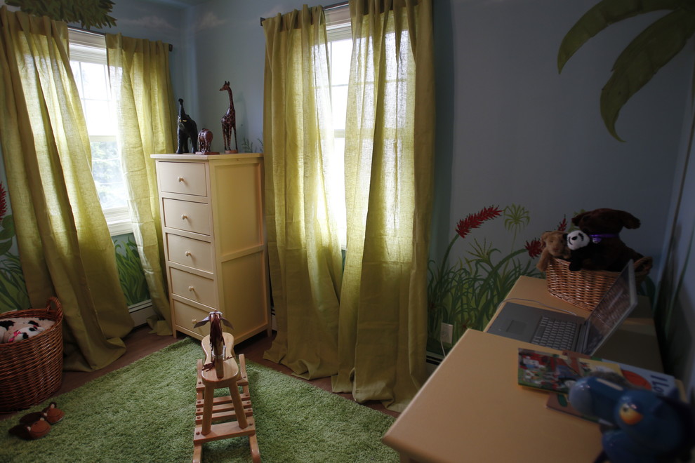 Example of a mid-sized classic boy medium tone wood floor kids' room design in Other with multicolored walls