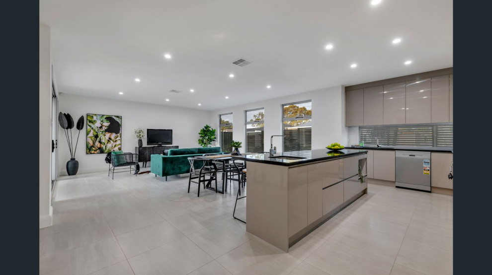 Design ideas for a mid-sized contemporary open plan dining in Adelaide with white walls, ceramic floors and grey floor.