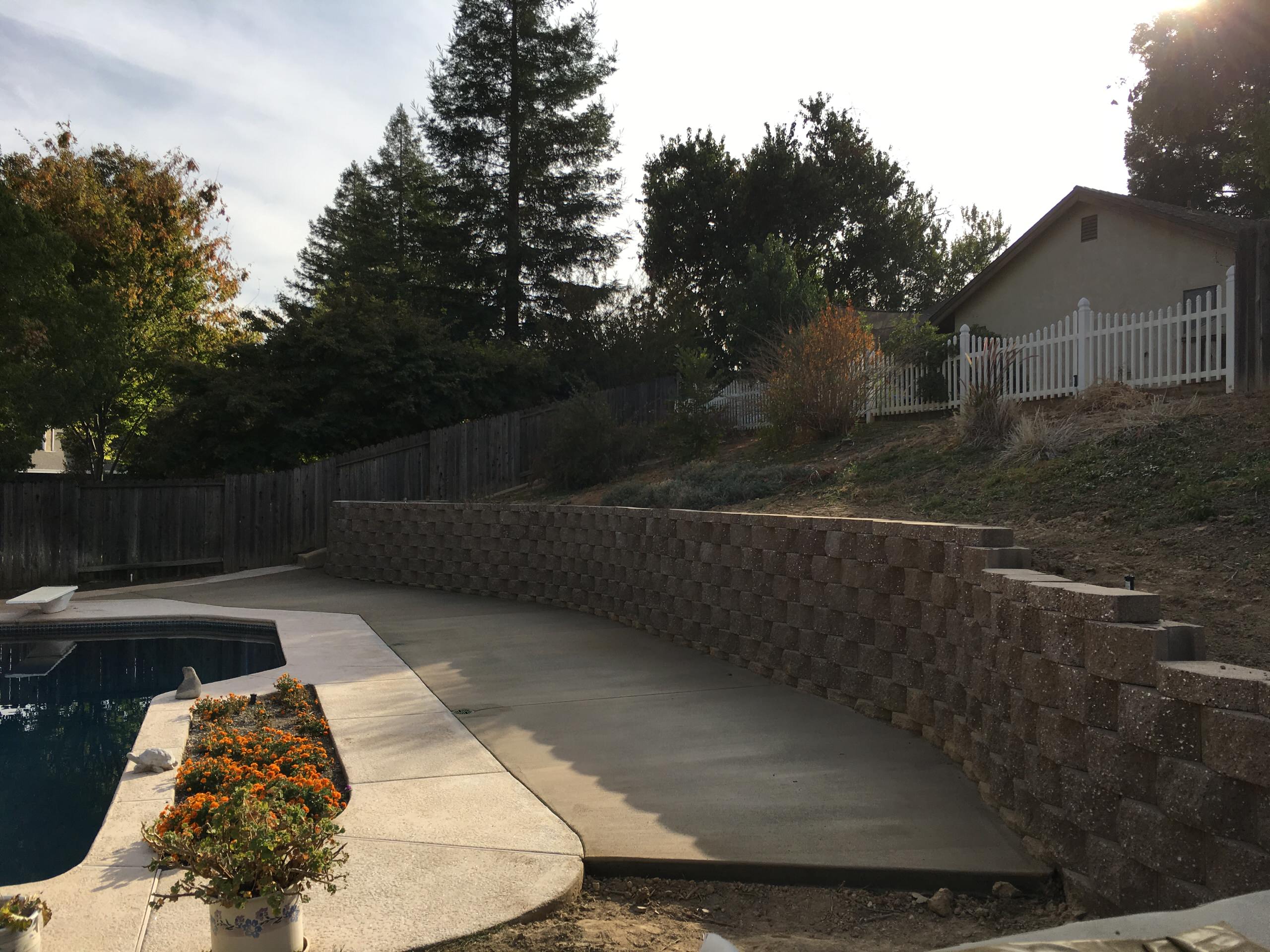 Retaining wall and added concrete for seating
