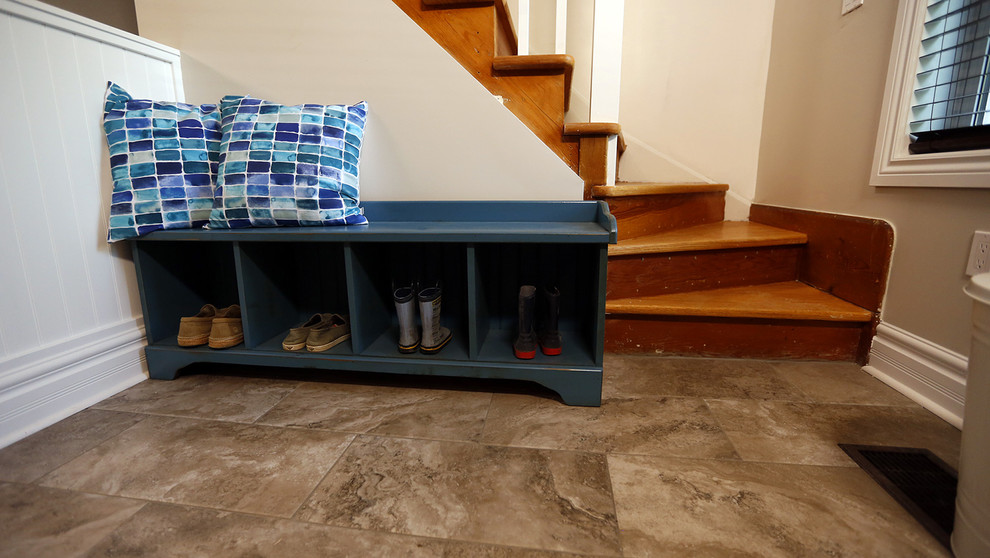 Inspiration for a small transitional ceramic tile mudroom remodel in Toronto with beige walls