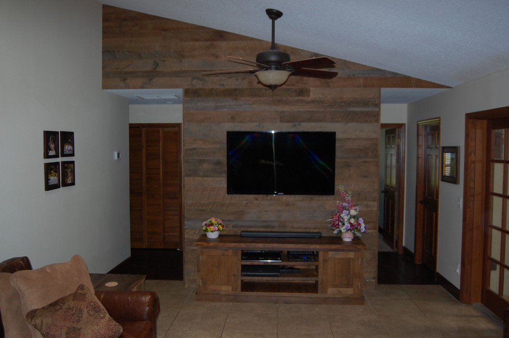 Photo of a mid-sized country living room in Orlando with white walls, ceramic floors, no fireplace and a wall-mounted tv.