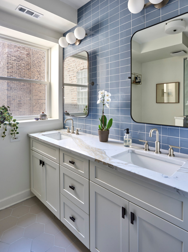 Medium sized classic ensuite wet room bathroom in Chicago with recessed-panel cabinets, white cabinets, blue tiles, porcelain tiles, blue walls, porcelain flooring, a submerged sink, quartz worktops, grey floors, a hinged door, white worktops, a wall niche, double sinks and a freestanding vanity unit.
