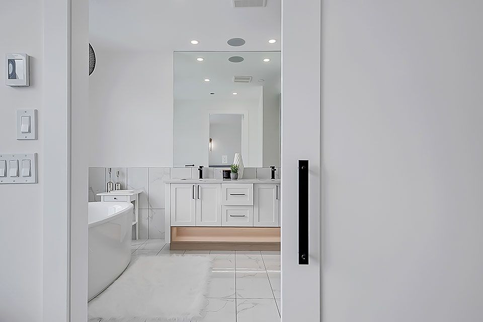 Example of a transitional home design design in Calgary