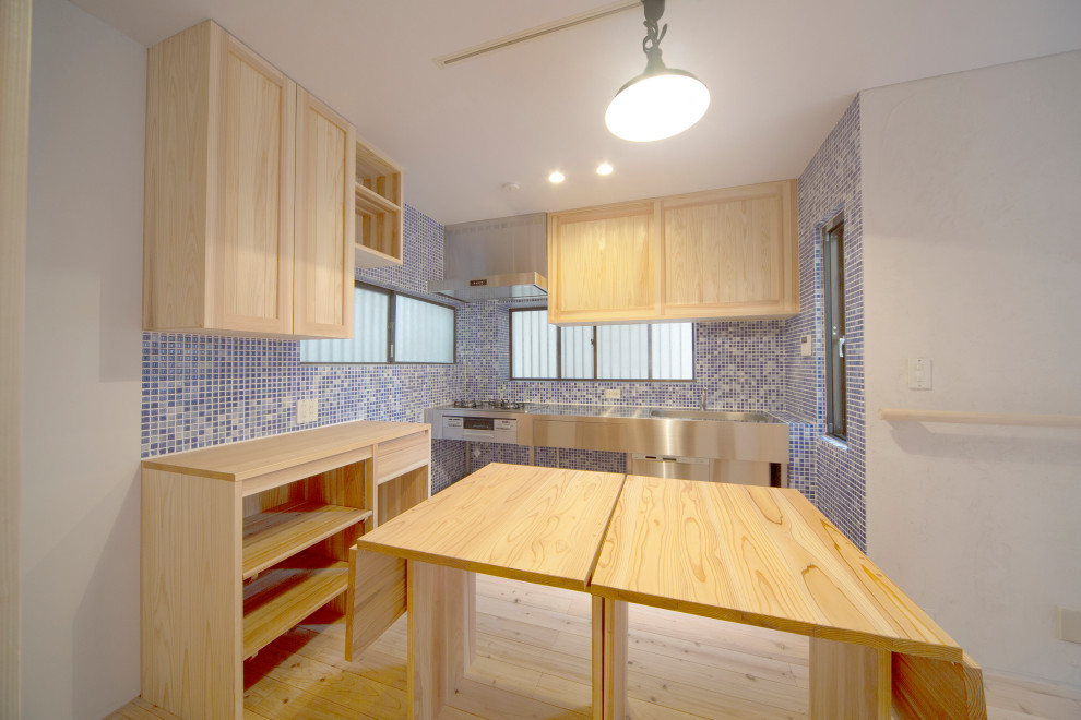Inspiration for a small scandinavian single-wall open plan kitchen in Tokyo Suburbs with beige cabinets, stainless steel benchtops, light hardwood floors, beige floor and beige benchtop.