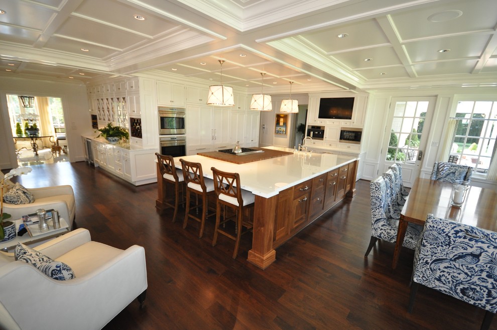 Design ideas for a large traditional l-shaped eat-in kitchen in Dallas with an undermount sink, shaker cabinets, white cabinets, marble benchtops, stainless steel appliances, dark hardwood floors and with island.