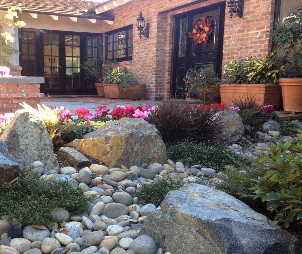 Inspiration for a large eclectic front yard garden in San Diego with a garden path.