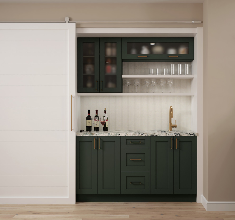 This is an example of a mid-sized transitional single-wall wet bar in Miami with an undermount sink, flat-panel cabinets, green cabinets, quartzite benchtops, white splashback, mosaic tile splashback, light hardwood floors, brown floor and white benchtop.