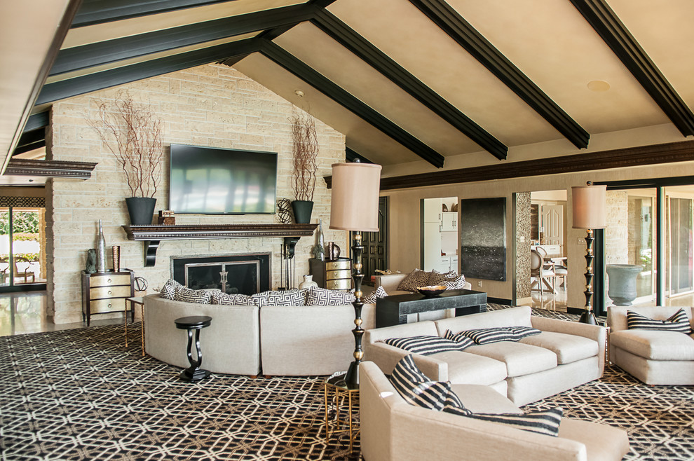 Inspiration for a large traditional open concept family room in Other with beige walls, carpet, a standard fireplace, a stone fireplace surround and a wall-mounted tv.