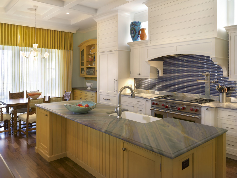 This is an example of a large contemporary l-shaped eat-in kitchen in Tampa with a single-bowl sink, beaded inset cabinets, yellow cabinets, blue splashback, stainless steel appliances, soapstone benchtops, matchstick tile splashback, dark hardwood floors, with island and brown floor.