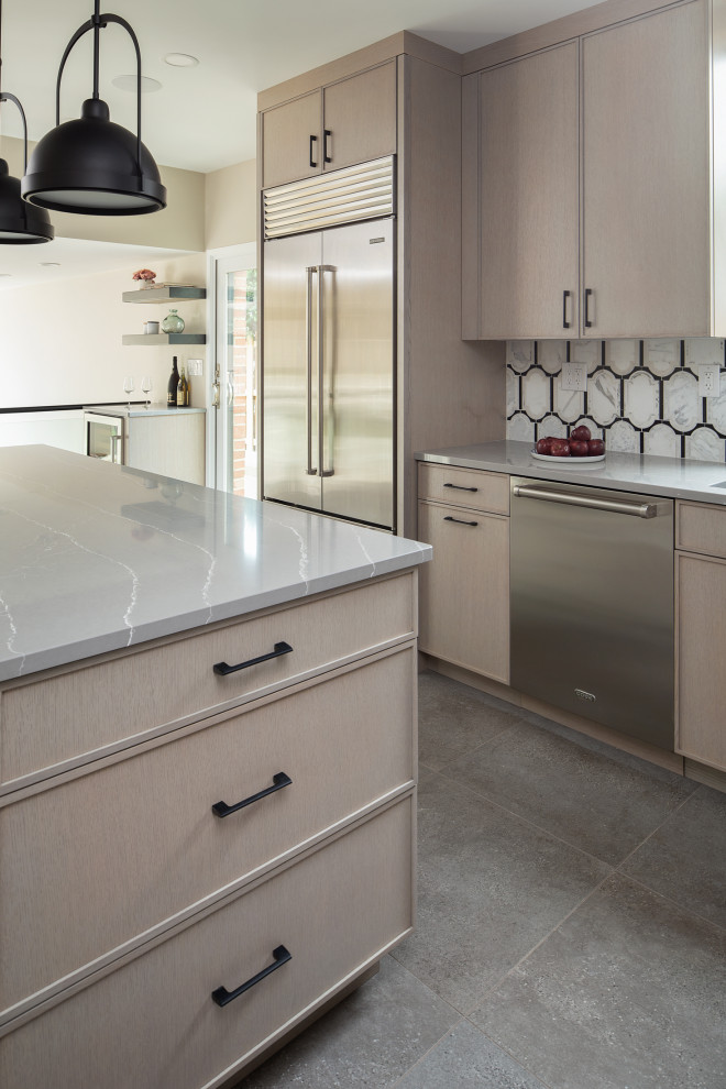 Transitional kitchen photo with an island