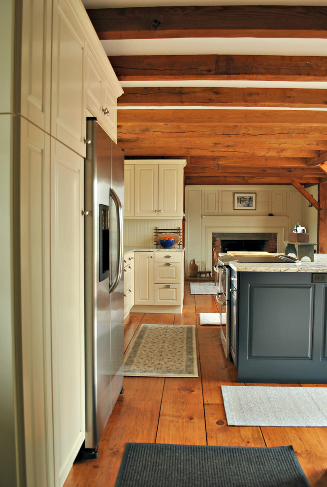 Inspiration for a mid-sized rustic l-shaped medium tone wood floor and brown floor eat-in kitchen remodel in Boston with a farmhouse sink, raised-panel cabinets, blue cabinets, granite countertops, beige backsplash, wood backsplash, stainless steel appliances and an island