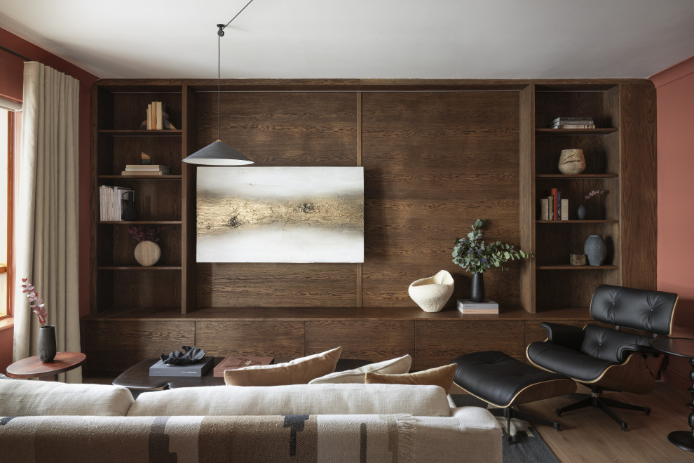 Design ideas for a contemporary living room in Dublin With Red Walls, Medium Hardwood Flooring, a Wall Mounted TV, Brown Floors and Wood Walls.