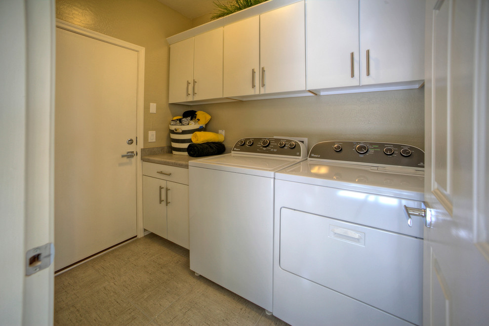 Design ideas for a small contemporary single-wall dedicated laundry room in Phoenix with flat-panel cabinets, white cabinets, laminate benchtops, beige walls, ceramic floors and a side-by-side washer and dryer.