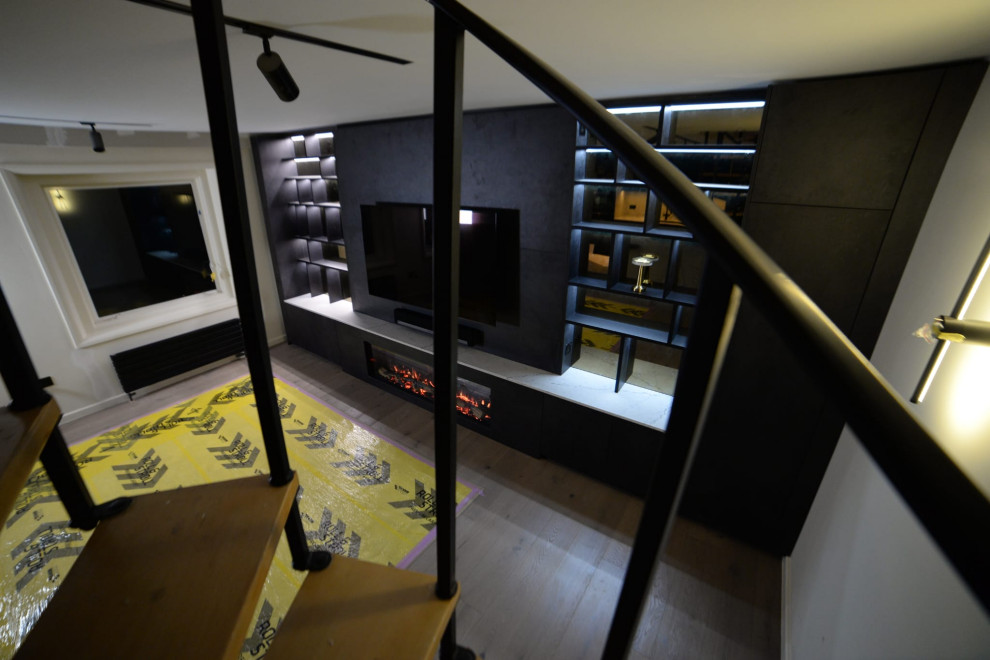 Modern Living Room with Bespoke Shelf Unit and Spiral Staircase
