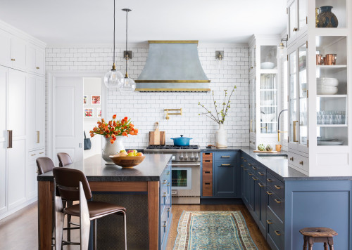 Light blue cabinetry kitchen with patterned tile floors in a