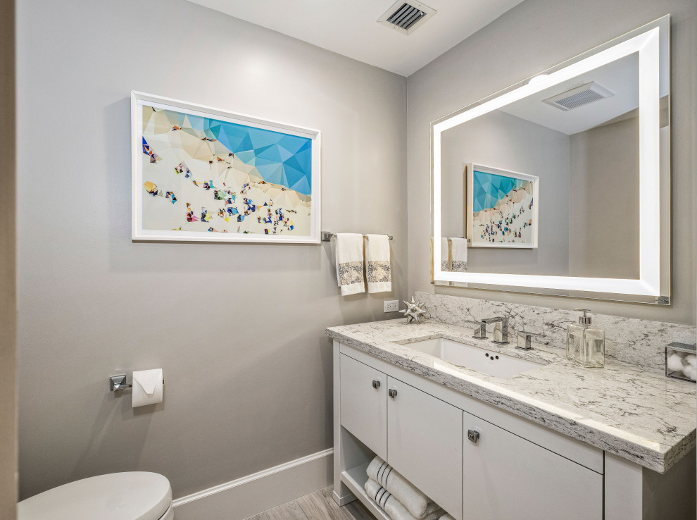 Large trendy kids' white tile and porcelain tile porcelain tile, white floor and single-sink doorless shower photo in Miami with recessed-panel cabinets, white cabinets, white walls, an undermount sink, marble countertops, a hinged shower door, white countertops, a niche and a built-in vanity