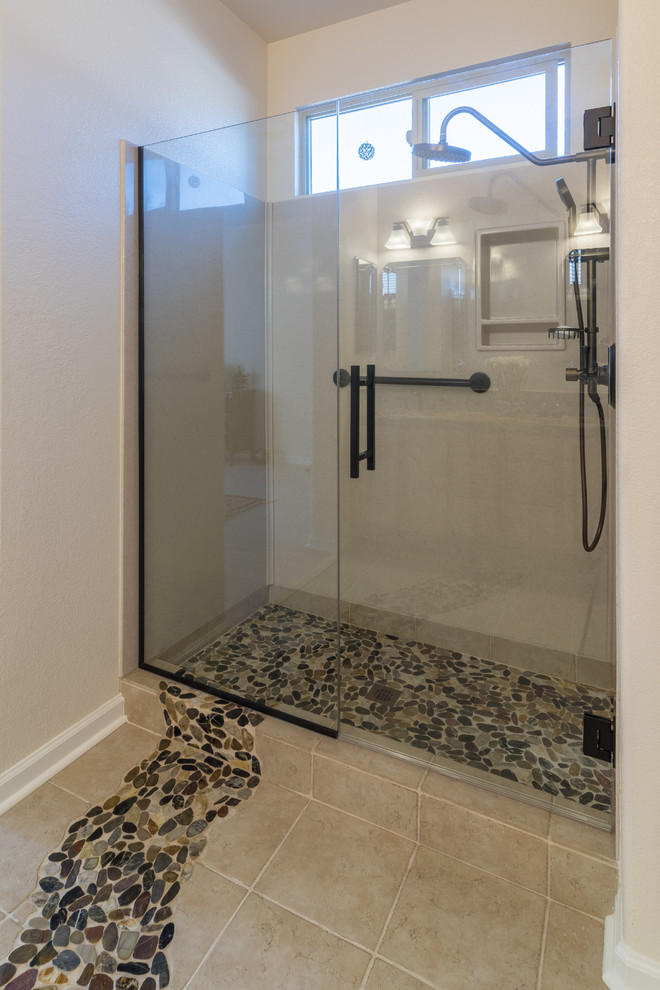Photo of a large contemporary 3/4 bathroom in Sacramento with shaker cabinets, light wood cabinets, an alcove shower, a two-piece toilet, beige tile, ceramic tile, white walls, ceramic floors, an undermount sink and engineered quartz benchtops.