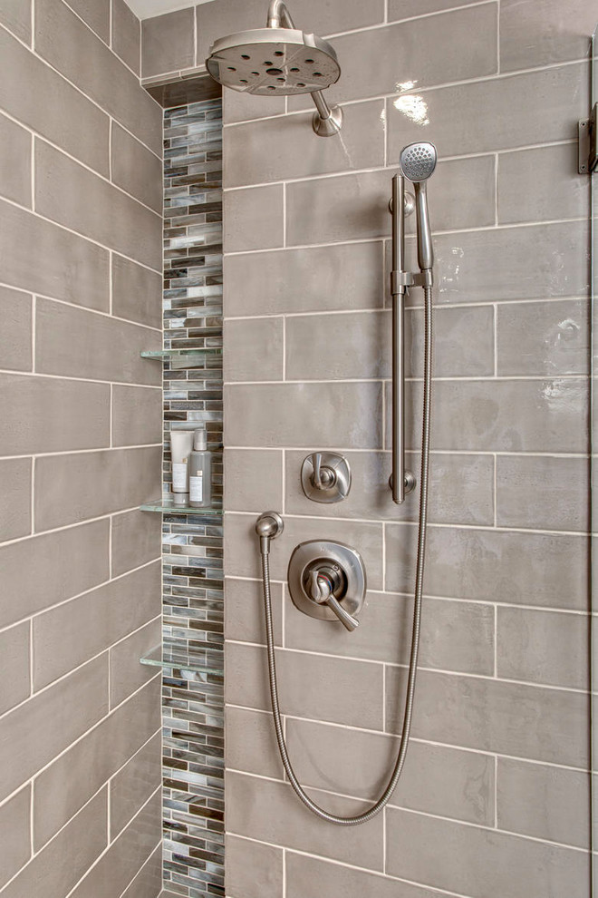 Freestanding bathtub - large transitional master multicolored tile and matchstick tile pebble tile floor freestanding bathtub idea in Seattle with shaker cabinets, dark wood cabinets, a two-piece toilet, beige walls, an undermount sink and quartz countertops