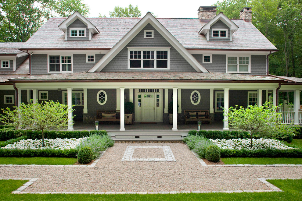 Design ideas for a traditional three-storey grey exterior in New York with wood siding.