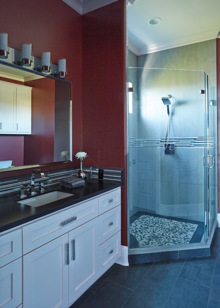 Inspiration for a small modern 3/4 bathroom in Other with shaker cabinets, white cabinets, a corner shower, porcelain floors, a drop-in sink, onyx benchtops, grey floor, a hinged shower door, black benchtops, a single vanity and a built-in vanity.
