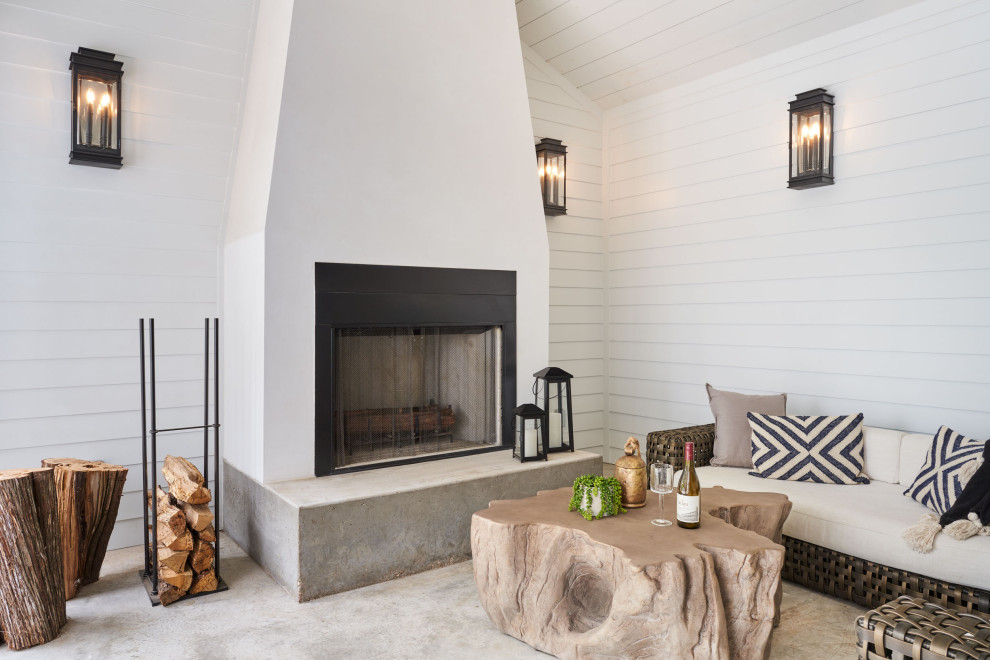 Mid-sized transitional back porch idea in Austin with a fireplace