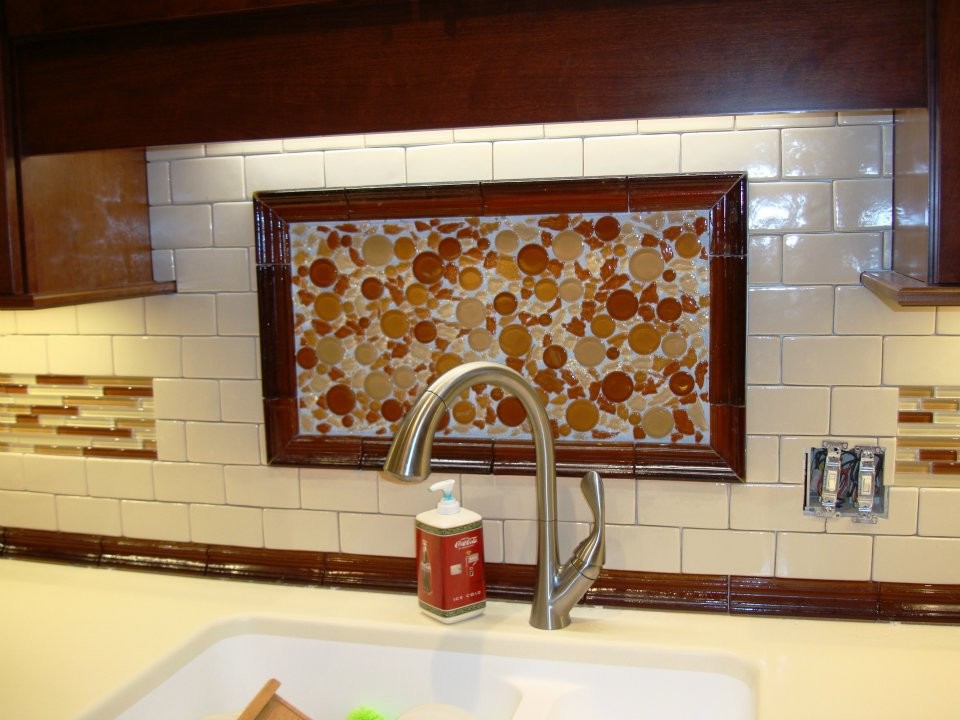 Example of a mid-sized transitional kitchen design with beige backsplash, subway tile backsplash and beige countertops