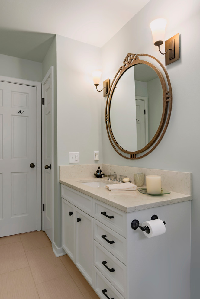 Inspiration for a mid-sized transitional bathroom in Seattle with recessed-panel cabinets, grey cabinets, an alcove tub, a shower/bathtub combo, a one-piece toilet, gray tile, porcelain tile, grey walls, porcelain floors, an undermount sink, engineered quartz benchtops, beige floor and a shower curtain.