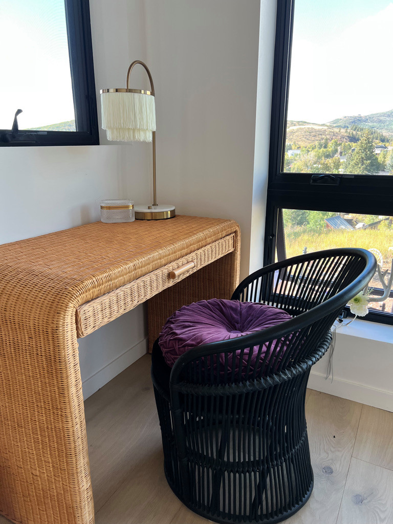 Cozy corner, natural and black rattan and fringes!