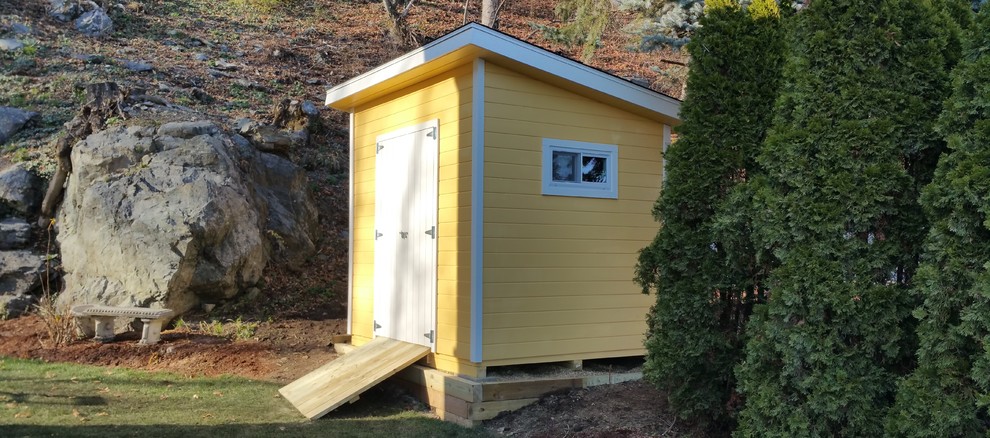 This is an example of a small modern detached garden shed in Boston.