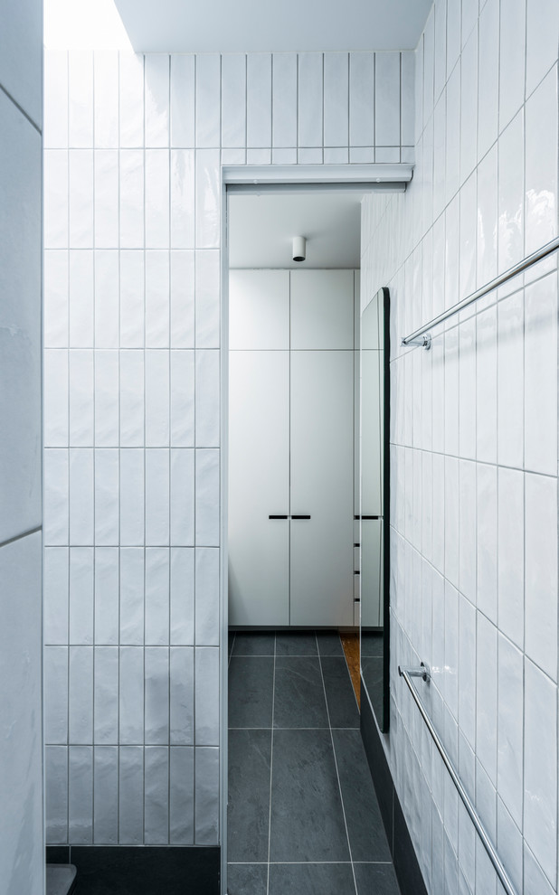 Small modern master bathroom in Melbourne with flat-panel cabinets, light wood cabinets, an alcove shower, a one-piece toilet, white tile, ceramic tile, white walls, porcelain floors, a vessel sink, wood benchtops, grey floor and an open shower.