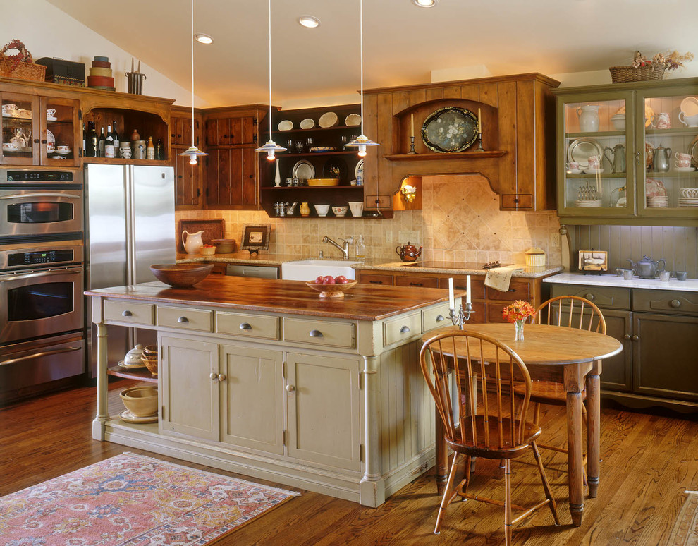 Design ideas for a country galley kitchen in San Diego with a farmhouse sink, medium wood cabinets, wood benchtops and beige splashback.