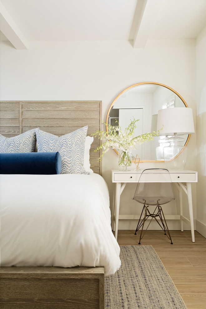 Inspiration for a transitional bedroom in Tampa with white walls and brown floor.