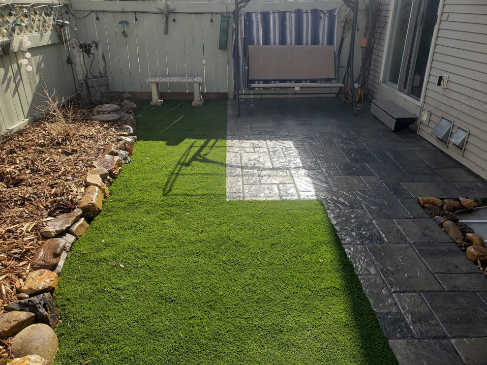 Photo of a small rustic partial sun backyard brick landscaping for summer.
