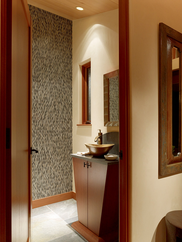 This is an example of a contemporary powder room in San Francisco with a vessel sink, furniture-like cabinets and medium wood cabinets.