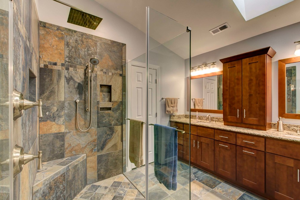 Design ideas for a mid-sized traditional master bathroom in Raleigh with an undermount sink, shaker cabinets, medium wood cabinets, granite benchtops, a curbless shower, a two-piece toilet, multi-coloured tile, ceramic tile, yellow walls and ceramic floors.