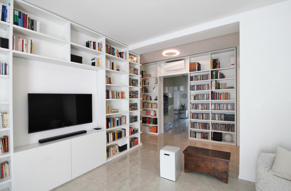 Immagine di un soggiorno design con libreria e pavimento in gres porcellanato