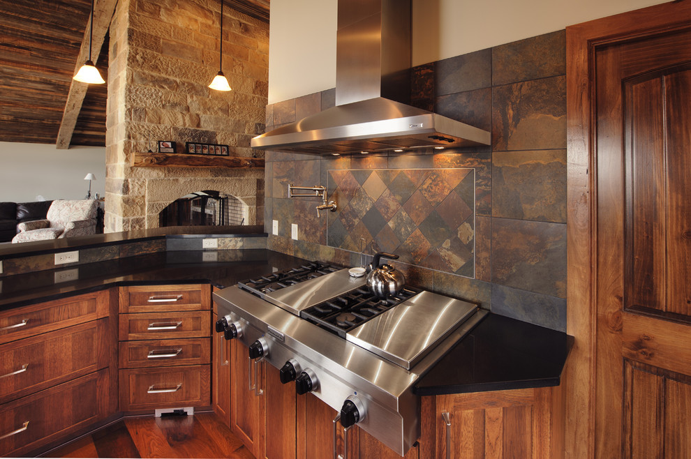 This is an example of a country open plan kitchen in Cleveland.