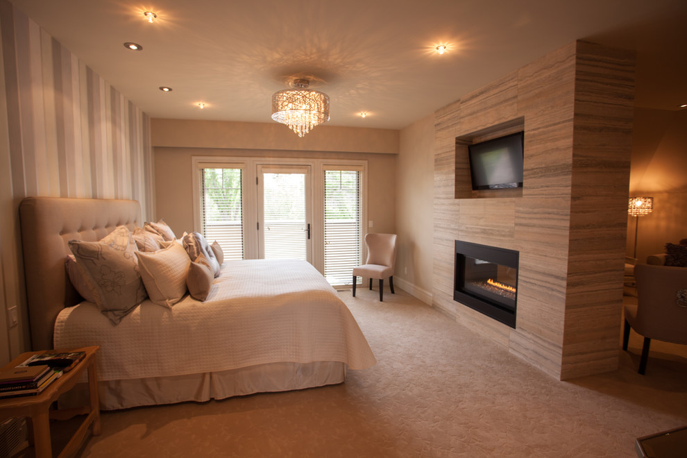 Design ideas for a large traditional master bedroom in Calgary with multi-coloured walls, carpet, a two-sided fireplace and a tile fireplace surround.